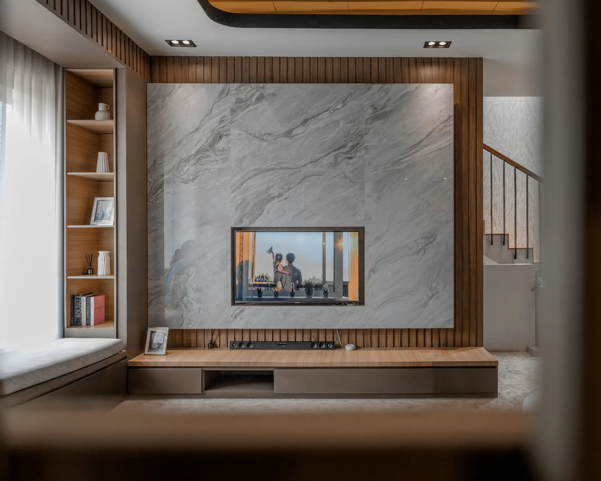 Minimalist fireplace and tactile stone surfaces in a New Zealand residence