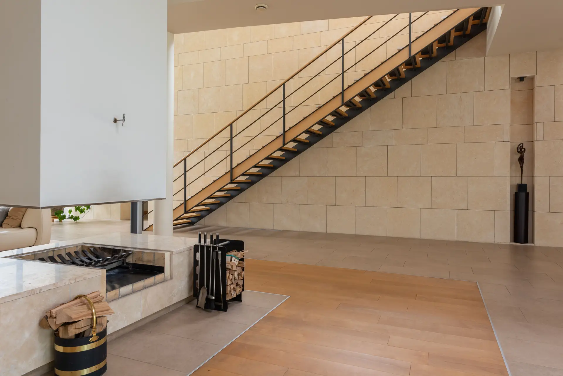 Contemporary interior hall displaying refined natural timber partition and soft daylight