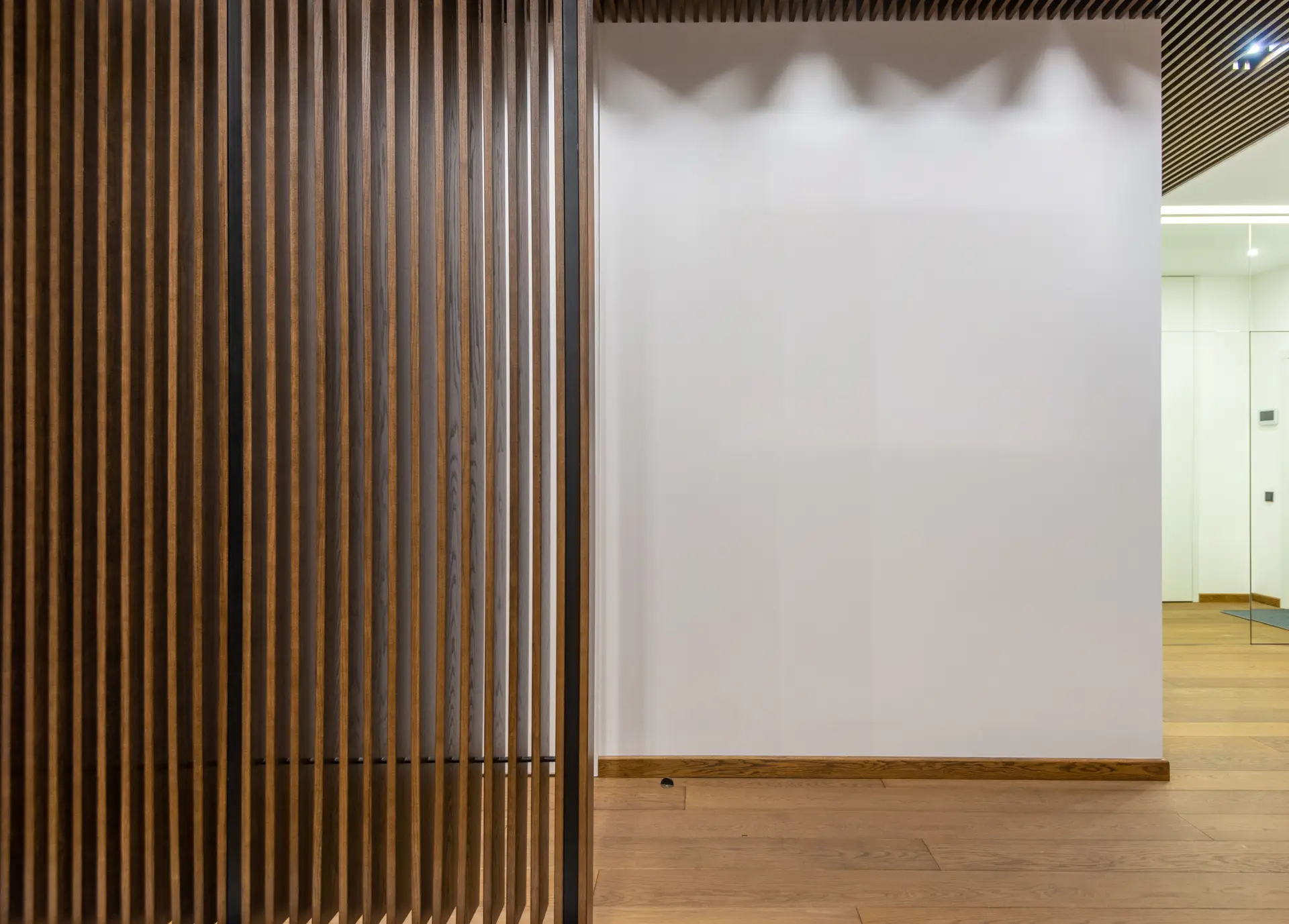 Warm timber partitions and natural floorboards delivering comforting domestic atmosphere