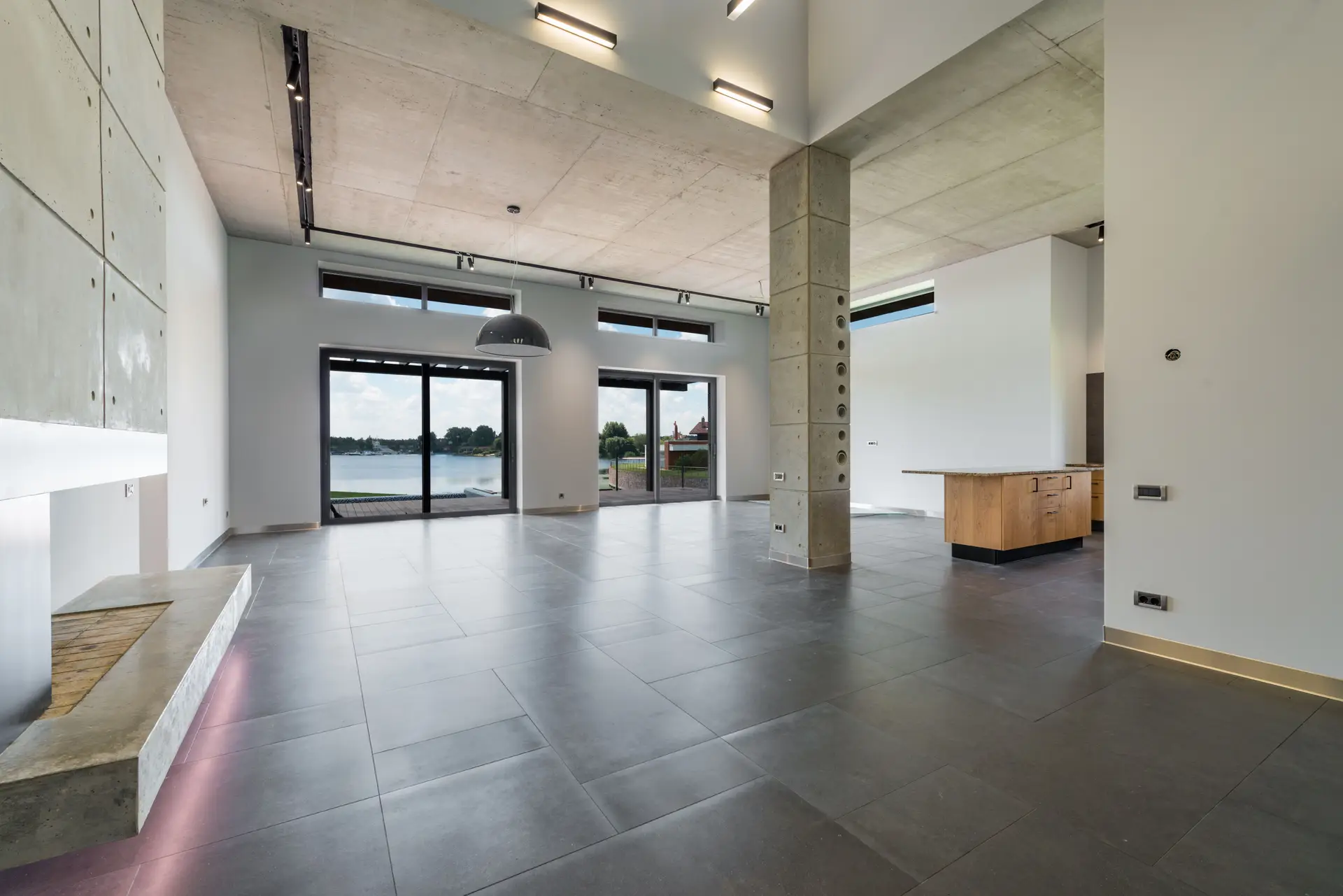 Lakeview architectural residence with panoramic windows and natural timber elements